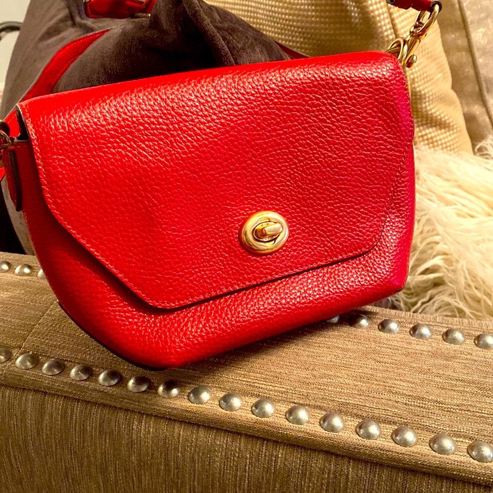 Red pebbled leather coach crossbody bag never worn.